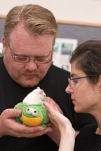 A couple examines a potential adoptee. The Wonderful World of Rats, San Mateo, California, USA. - Photo #6014