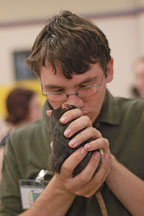 Volunteer Justin Harvey says hello to a pet rat. The Wonderful World of Rats, San Mateo, California, USA. - Photo #6026