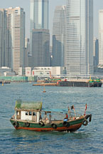 Small fishing boat in Victoria Harbor. Hong Kong, China. - Photo #15634