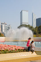 Two girls by the fountain in Hong Kong Park. Hong Kong, China. - Photo #16441