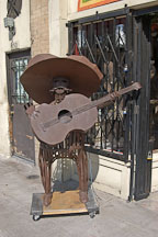 Iron sculpture of man playing the guitar. El Pueblo de la Reina  de los Angeles. Los Angeles, California, USA. - Photo #7243