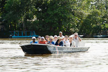 Tourists in Tortuguero watching wildlife from a boat. Costa Rica. - Photo #14046