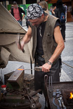 Blacksmith hammering heated metal bar. Prague, Czech Republic. - Photo #30050