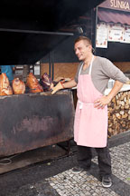 Man cooking roast pork on barbeque. Prague, Czech Republic. - Photo #29609